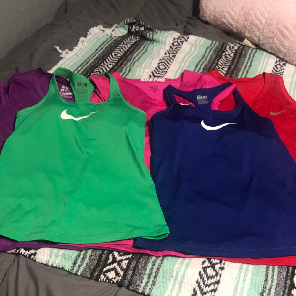 Bundle of 5 medium Nike shirts.